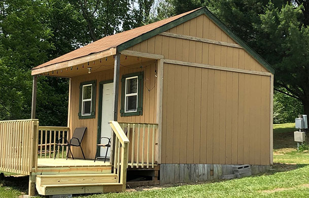 rustic lakefront sleeping cabin rental exterior